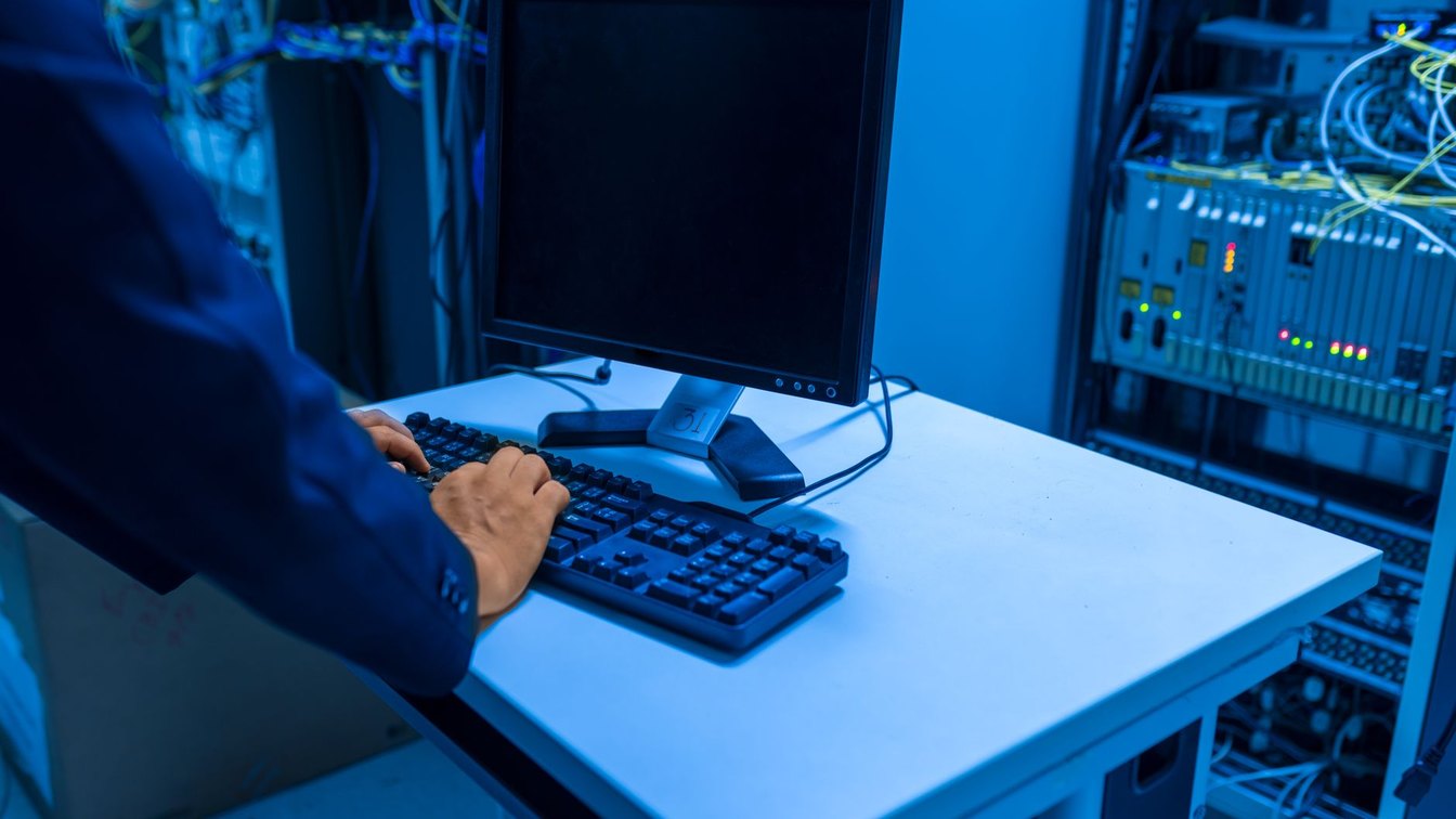 IT technician working on server infrastructure in a data center