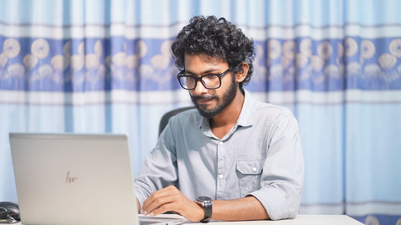 A developer reviewing settings on a laptop before making a change